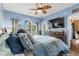 Cozy main bedroom with a ceiling fan, large window, and a flatscreen TV at 4173 Hibiscus Dr. # 204, Little River, SC 29566
