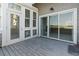 Back patio with multiple entry doors and glass windows at 4396 Baldwin Ave. # 138, Little River, SC 29566