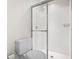 Bathroom showcasing a glass door shower with white tile surround and sleek fixtures at 4396 Baldwin Ave. # 138, Little River, SC 29566