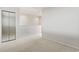 Light and airy bedroom with a mirrored closet, neutral carpet, and white walls at 4396 Baldwin Ave. # 138, Little River, SC 29566