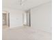 This spacious bedroom features neutral walls and carpet, ceiling fan, and convenient ensuite bathroom access at 4396 Baldwin Ave. # 138, Little River, SC 29566