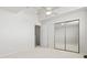 Bedroom featuring mirrored closet doors, neutral walls, and a ceiling fan providing a comfortable space at 4396 Baldwin Ave. # 138, Little River, SC 29566