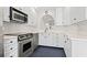 Well-equipped kitchen with stainless steel appliances, white cabinetry, and counter space ideal for cooking and entertaining at 4396 Baldwin Ave. # 138, Little River, SC 29566