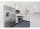 Bright kitchen featuring stainless steel appliances, ample white cabinetry, and modern finishes for a functional cooking space at 4396 Baldwin Ave. # 138, Little River, SC 29566