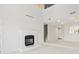 Bright living room with a fireplace and high ceilings with open stairwell at 4396 Baldwin Ave. # 138, Little River, SC 29566