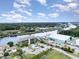Aerial view of waterfront condos with a swimming pool, boat storage facility, and river views at 4445 Kingsport Rd. # 406, Little River, SC 29566