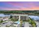 Aerial view of riverside condos with parking, pool, and intracoastal waterway at 4445 Kingsport Rd. # 406, Little River, SC 29566