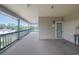 Wide covered condo balcony with view of neighborhood, outdoor access to unit 406 at 4445 Kingsport Rd. # 406, Little River, SC 29566