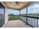 Condo balcony with ceiling fan and expansive views of the intercostal waterway and trees at 4445 Kingsport Rd. # 406, Little River, SC 29566