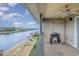 Balcony showing waterfront views and an outdoor grill with a ceiling fan for added comfort at 4445 Kingsport Rd. # 406, Little River, SC 29566