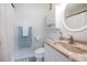 Clean and simple bathroom offers a vanity, commode, and shower with lots of natural light at 4445 Kingsport Rd. # 406, Little River, SC 29566