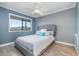 Cozy bedroom features a ceiling fan, a large window, and a comfortable bed, perfect for relaxation at 4445 Kingsport Rd. # 406, Little River, SC 29566