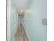 Hallway with wood-look flooring that creates an inviting and cohesive transition between spaces in the home at 4445 Kingsport Rd. # 406, Little River, SC 29566