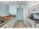 Bright kitchen features granite countertops, white cabinetry, and modern appliances for a fresh, updated look at 4445 Kingsport Rd. # 406, Little River, SC 29566
