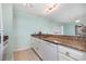 This bright kitchen features granite countertops and a breakfast bar, perfect for casual dining and entertaining at 4445 Kingsport Rd. # 406, Little River, SC 29566