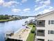 Waterfront condo featuring a private balcony overlooking a waterway and deck at 4445 Kingsport Rd. # 406, Little River, SC 29566