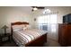 The bedroom includes a ceiling fan, and window with bright natural light at 449 Pennington Loop, Myrtle Beach, SC 29588
