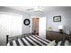 This bright bedroom features a striped comforter, ceiling fan, and an open closet at 449 Pennington Loop, Myrtle Beach, SC 29588