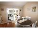Cozy dining area with table for six and sliding glass doors leading to the sunroom at 449 Pennington Loop, Myrtle Beach, SC 29588