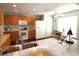 Spacious kitchen featuring wood cabinets, marble countertops, and stainless steel sink at 449 Pennington Loop, Myrtle Beach, SC 29588