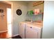 This laundry room offers a washer and dryer, along with shelving for storage at 449 Pennington Loop, Myrtle Beach, SC 29588
