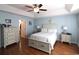 Comfortable bedroom featuring a tray ceiling, stylish fan, and a large dresser with bright windows at 449 Pennington Loop, Myrtle Beach, SC 29588