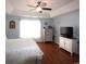 Cozy main bedroom featuring hardwood floors, neutral paint and a tray ceiling with ceiling fan at 449 Pennington Loop, Myrtle Beach, SC 29588