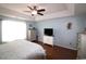 Lovely bedroom features a tray ceiling, hardwood floors and dresser with flatscreen TV at 449 Pennington Loop, Myrtle Beach, SC 29588