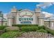 The Queens Harbour sign is prominently displayed, amidst manicured landscaping at 449 Pennington Loop, Myrtle Beach, SC 29588