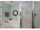 Bright bathroom features a soaking tub, a separate glass shower, and updated fixtures at 4545 Lighthouse Dr. # 28C, Little River, SC 29566
