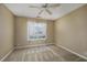Bedroom with a ceiling fan and natural light streaming through the window at 4545 Lighthouse Dr. # 28C, Little River, SC 29566
