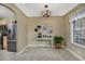 Charming dining area with tiled floors, a decorative table, and a view into the kitchen at 4545 Lighthouse Dr. # 28C, Little River, SC 29566