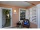 Welcoming front porch featuring a cozy chair, a 'welcome' pillow, and a charming floral wreath at 4545 Lighthouse Dr. # 28C, Little River, SC 29566