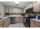 Well-lit kitchen features modern appliances, light wood cabinets, and decorative accents at 4545 Lighthouse Dr. # 28C, Little River, SC 29566