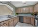Updated kitchen featuring marble countertops, light cabinets, and a stainless steel dishwasher at 4545 Lighthouse Dr. # 28C, Little River, SC 29566