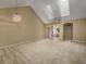 Open living space featuring vaulted ceilings, skylights, and sliding doors to the patio at 4545 Lighthouse Dr. # 28C, Little River, SC 29566