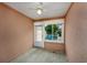Cozy sunroom with a window looking out to the patio and backyard at 4545 Lighthouse Dr. # 28C, Little River, SC 29566