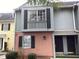 Charming condo with a gray and salmon exterior, complemented by black shutters and lush greenery at 501 44Th Ave. N # A-11, Myrtle Beach, SC 29577