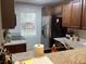 Kitchen featuring granite countertops, stainless steel appliances, and wood cabinetry at 501 44Th Ave. N # A-11, Myrtle Beach, SC 29577