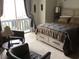 Bright main bedroom featuring a large window and two comfy chairs with a king bed at 501 44Th Ave. N # A-11, Myrtle Beach, SC 29577