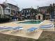 Community pool surrounded by lounge chairs and palm trees creating a relaxing atmosphere at 501 44Th Ave. N # A-11, Myrtle Beach, SC 29577