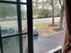 Street view from window with parked cars on the side of the road and trees at 501 44Th Ave. N # A-11, Myrtle Beach, SC 29577