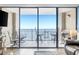View from the living room onto the balcony featuring ocean views and outdoor seating for relaxing or enjoying a meal at 5523 North Ocean Blvd. # 1912, Myrtle Beach, SC 29577