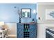 Stylish blue bar area with wine rack and storage for glassware and decor at 5523 North Ocean Blvd. # 1912, Myrtle Beach, SC 29577