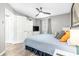 Bright bedroom featuring a TV, ceiling fan, neutral walls, and wood flooring at 5523 North Ocean Blvd. # 1912, Myrtle Beach, SC 29577