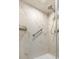 Elegant marble-style shower with grab bar and modern shower head at 5523 North Ocean Blvd. # 1912, Myrtle Beach, SC 29577
