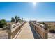 Scenic boardwalk leading to the ocean, offering breathtaking views and beach access at 5523 North Ocean Blvd. # 1912, Myrtle Beach, SC 29577