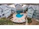 Aerial view of pool, sundeck and amenity center surrounded by condo units in a community at 5905 South Kings Hwy. # 4219-D, Myrtle Beach, SC 29575