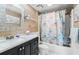 Bathroom features a vanity with marble countertops, a shower/tub combo with a shower curtain, and updated fixtures at 5905 South Kings Hwy. # 4219-D, Myrtle Beach, SC 29575