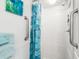 Clean, accessible shower stall with a shower curtain, towel rack, and grab bars for comfort and convenience at 5905 South Kings Hwy. # 4219-D, Myrtle Beach, SC 29575